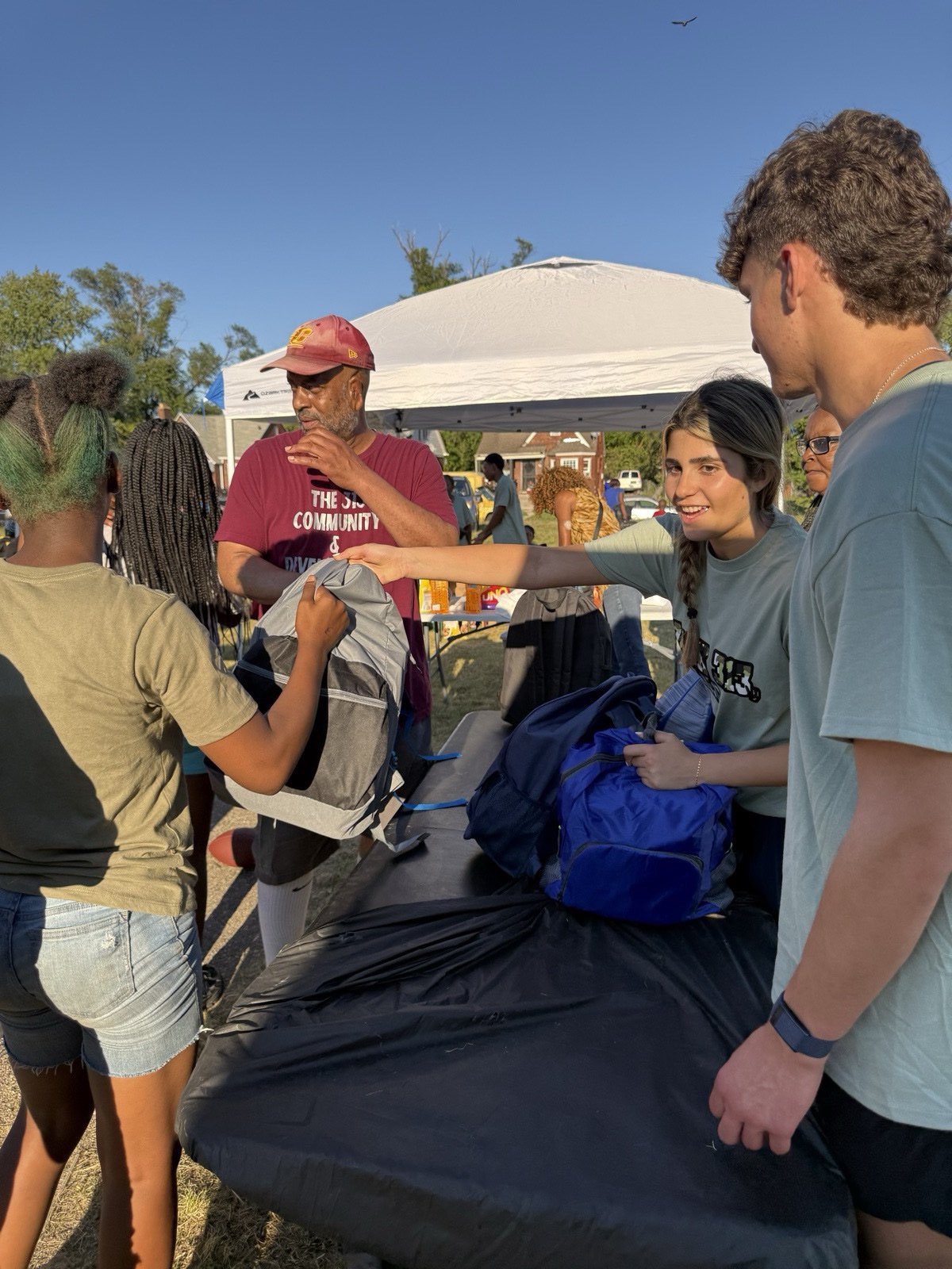 Volunteers helping students at the event